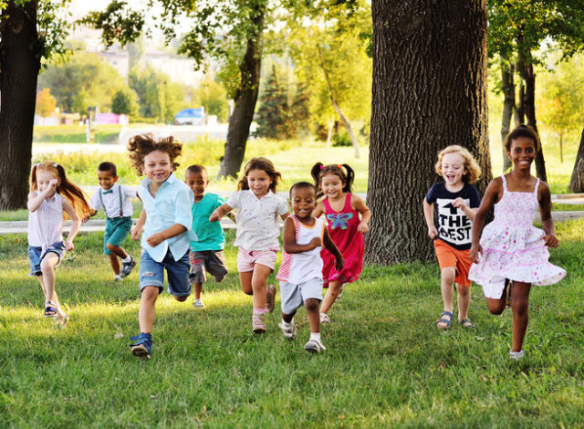Happy foster children outside