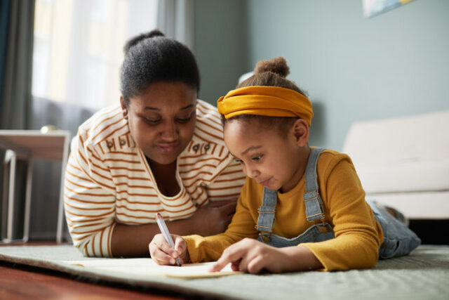 Foster Mom helping foster child with homework